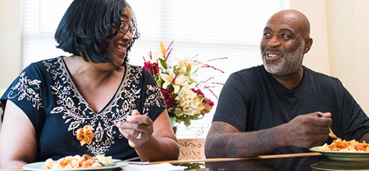 black couple eating a meal together