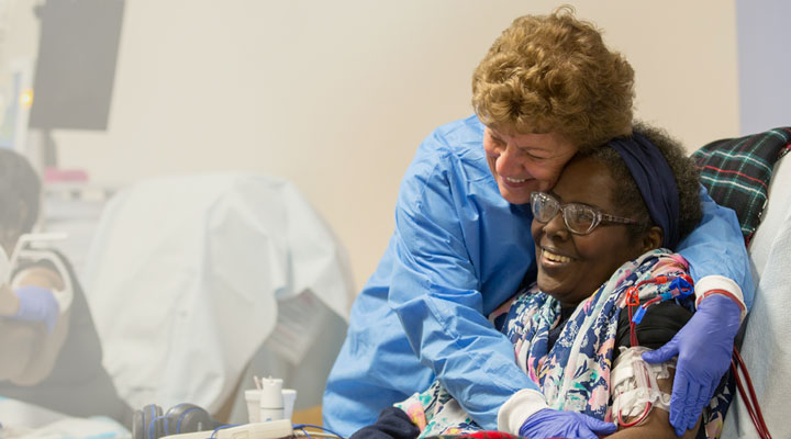 Nurse hugging patient