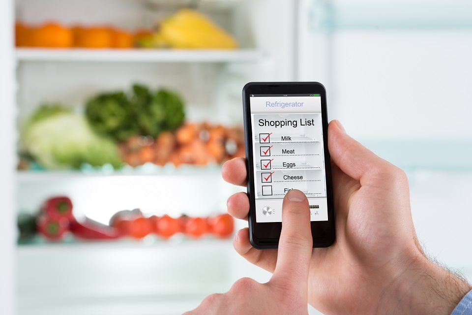 Person Hands Marking Shopping List On Mobile Phone Display