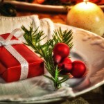 Christmas place setting with gift in a plate