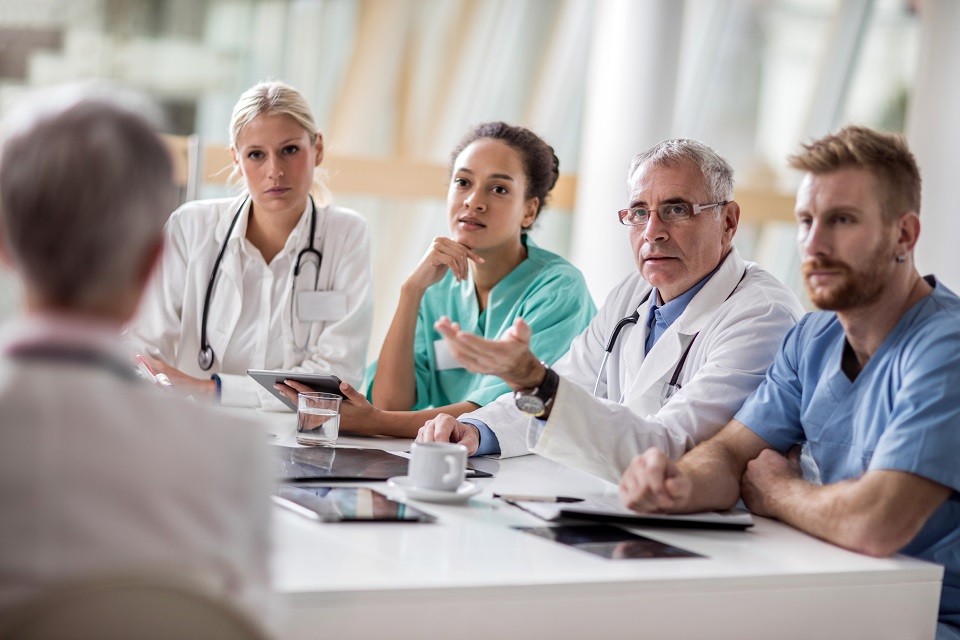 Group of healthcare workers talking on a meeting at hospital.