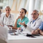 Group of healthcare workers talking on a meeting at hospital.