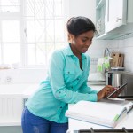 African woman searching for a recipe.
