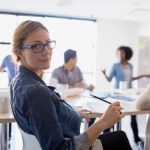 Portrait of confident businesswoman in meeting