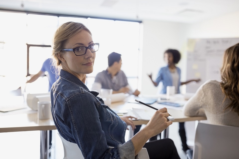 Portrait of confident businesswoman in meeting
