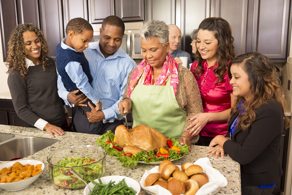 Thanksgiving:  Family and friends gather in kitchen to prepare meal.