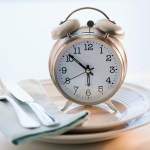 Alarm clock on plate