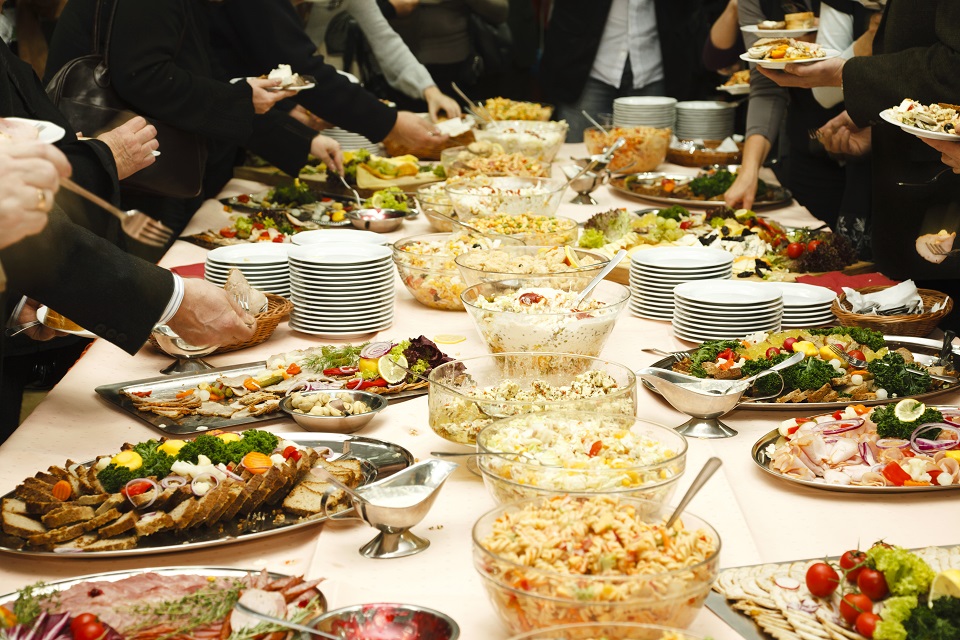 Catering table full of tasty food