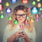 Woman using smartphone social media application icons flying out