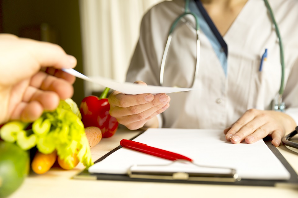 Vegetable diet nutrition and medication concept. Nutritionist offers healthy vegetables diet.