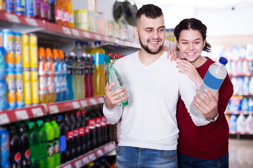 People selecting juice and soda
