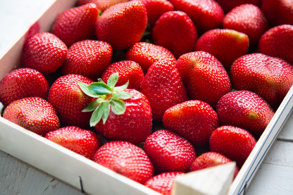 Fresh strawberries in a  wooden box