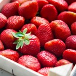 Fresh strawberries in a  wooden box