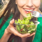 Woman eating healthy salad