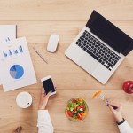 Healthy business lunch of woman at working place.