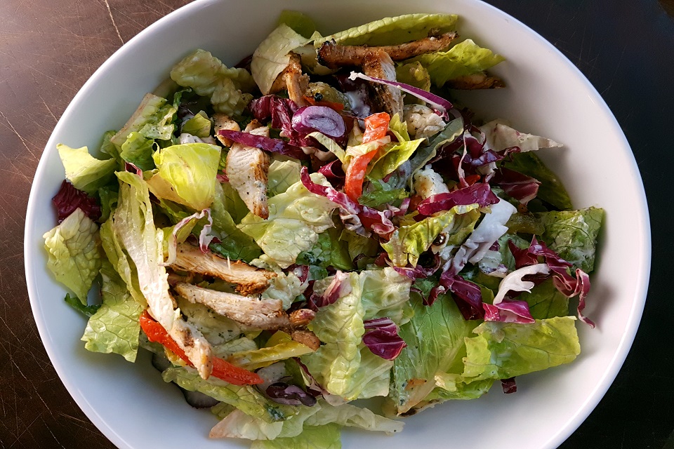 Prepared Halloumi salad served in white bowl