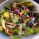 Prepared Halloumi salad served in white bowl