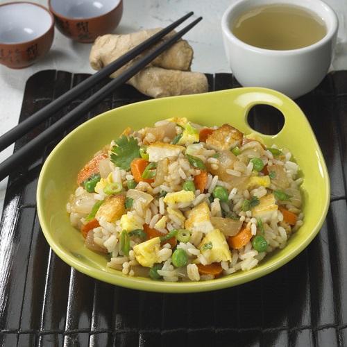 Vegetarian rice in dish with chop sticks