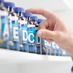 Pharmacist Selecting Pills on Shelf