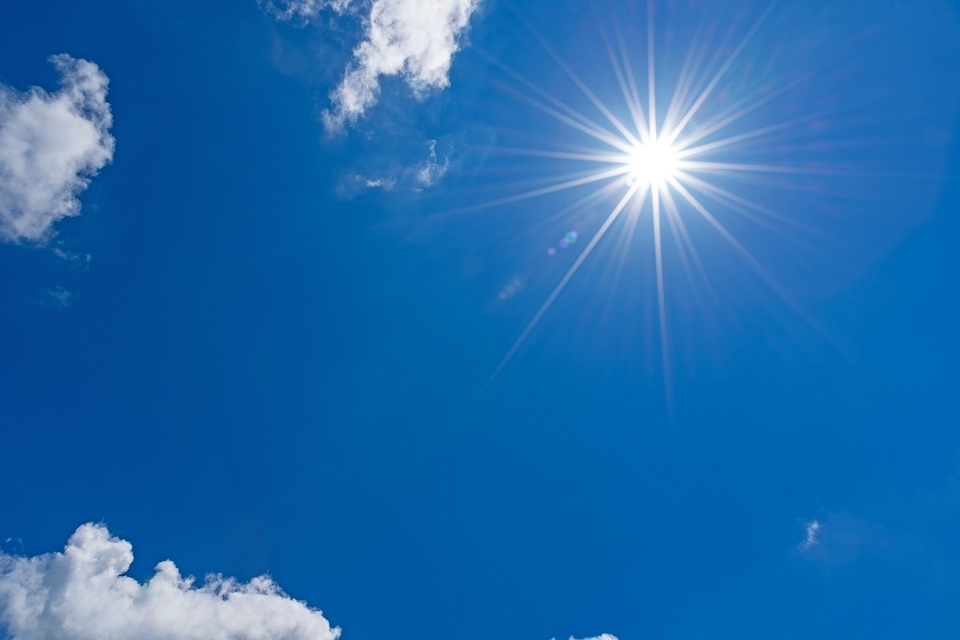 Blue sky with sun shining