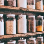 Jars of ingredients on wooden shelves