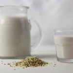 Hemp milk and a pile of hemp seeds
