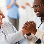 Male doctor with senior patient
