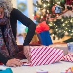 Woman wrapping holiday package