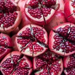 Close up of pomegranate halves on a table