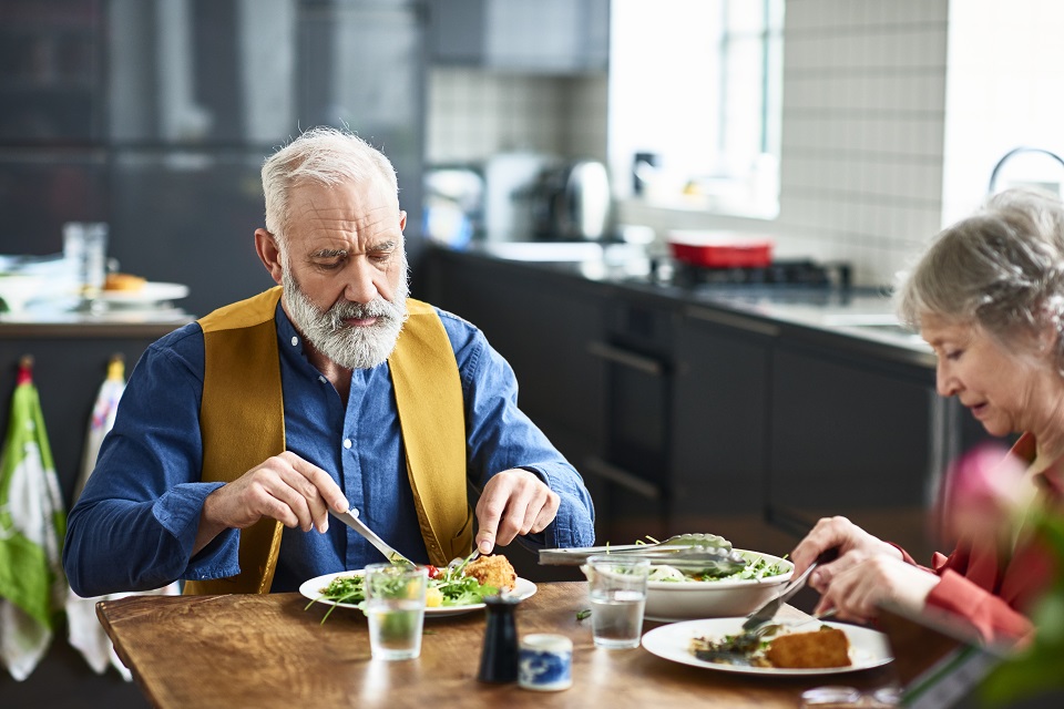Couple eating healthy salad for lunch