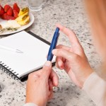 Diabetic woman checking her blood sugar levels