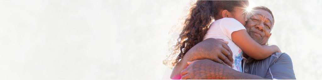 Man holding a young girl