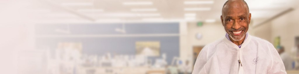 Picture of a healthcare worker smiling at the camera.