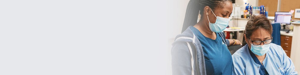 Two medical professionals with face masks