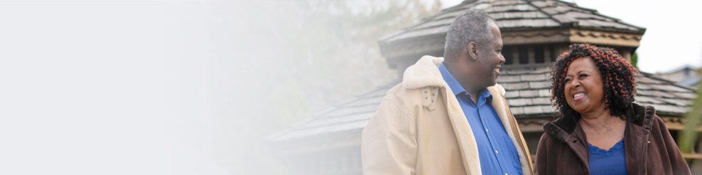 Man and wife looking at each other smiling