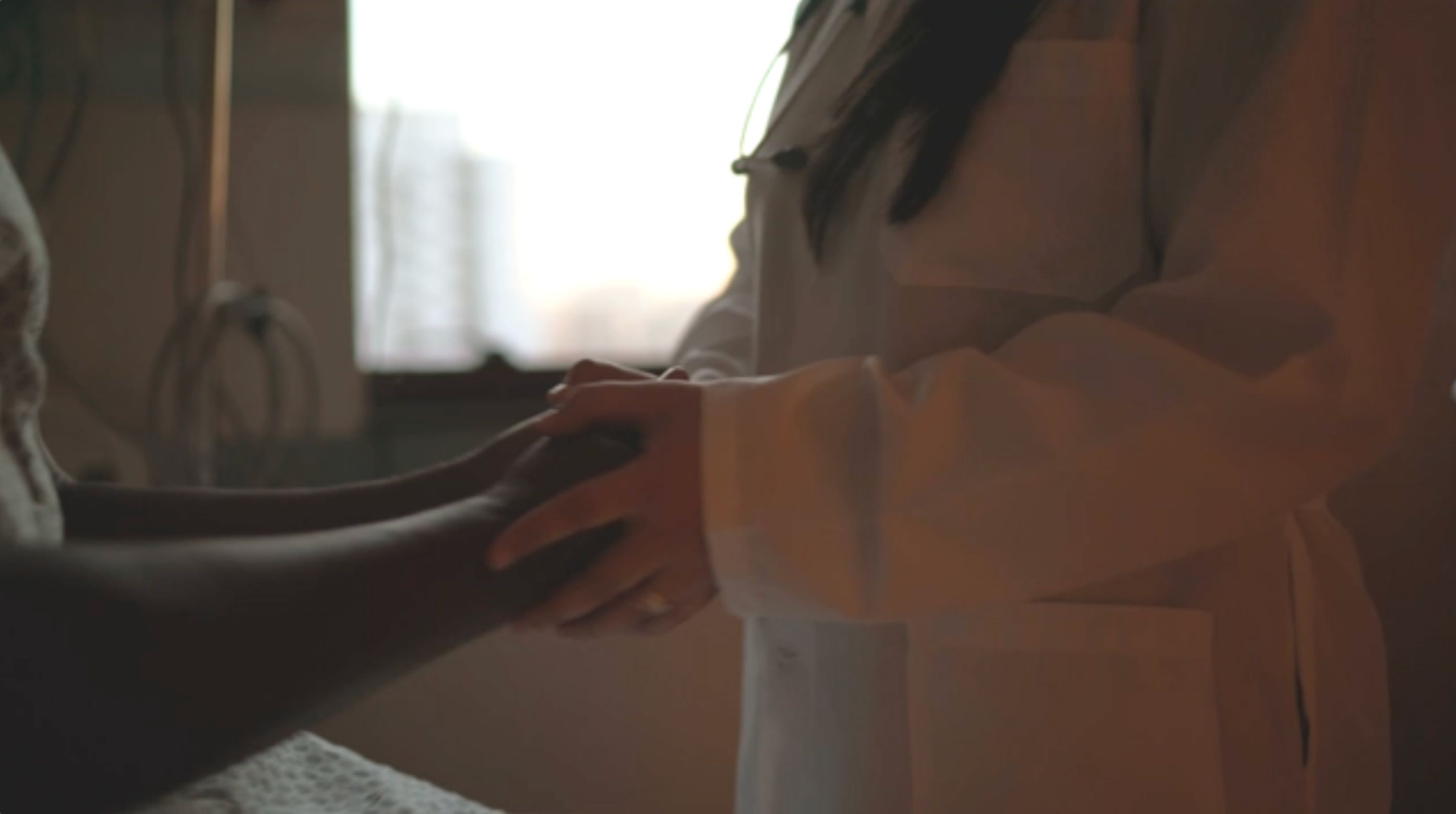 Clinician and patient shaking hands