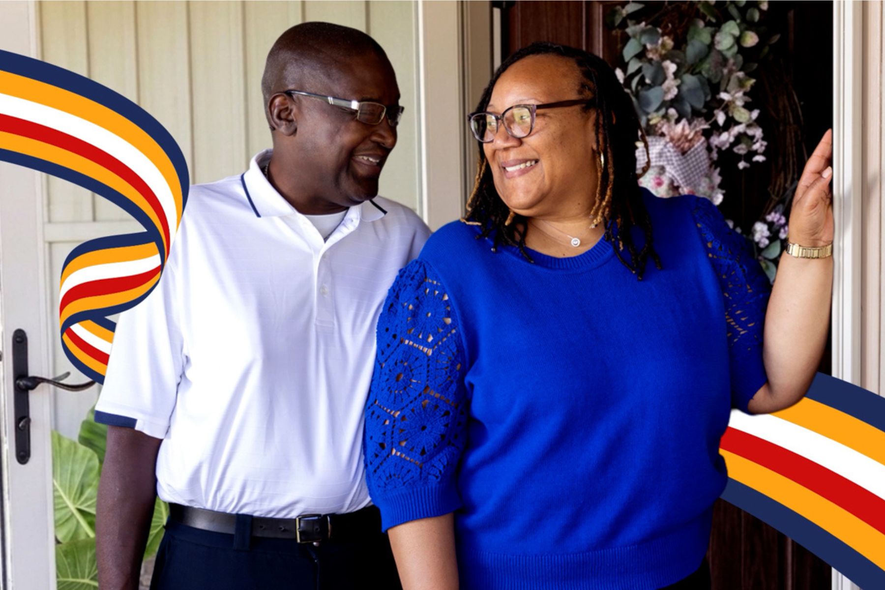 A couple smiling at one another with a ribbon graphic surround them