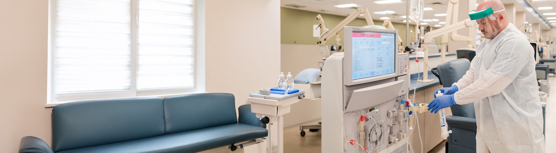 Healthcare professional replacing a dialysis machine with a Expanded HD dialyzer